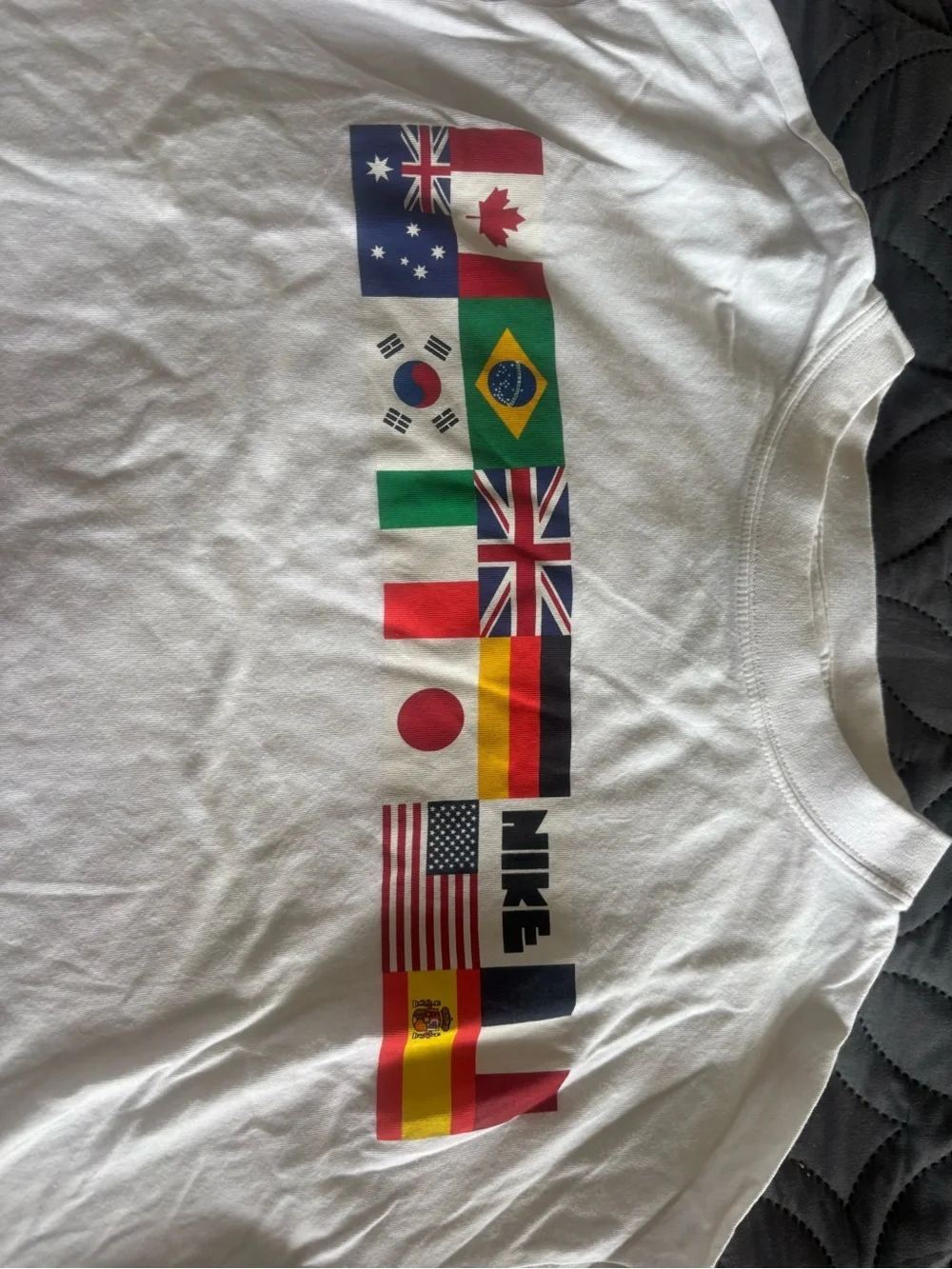 Nike White Crop Top with Multicolor Flag Graphics